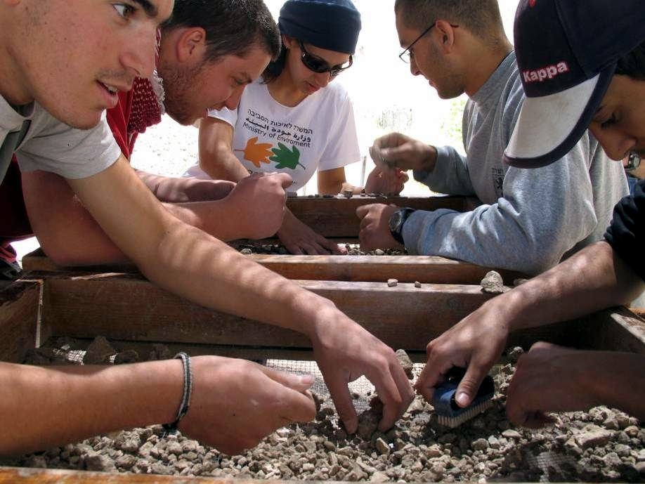 Volunteers sift through debris irresponsibly excavated from the Temple Mount.  (Photo by Zachi Dvira)