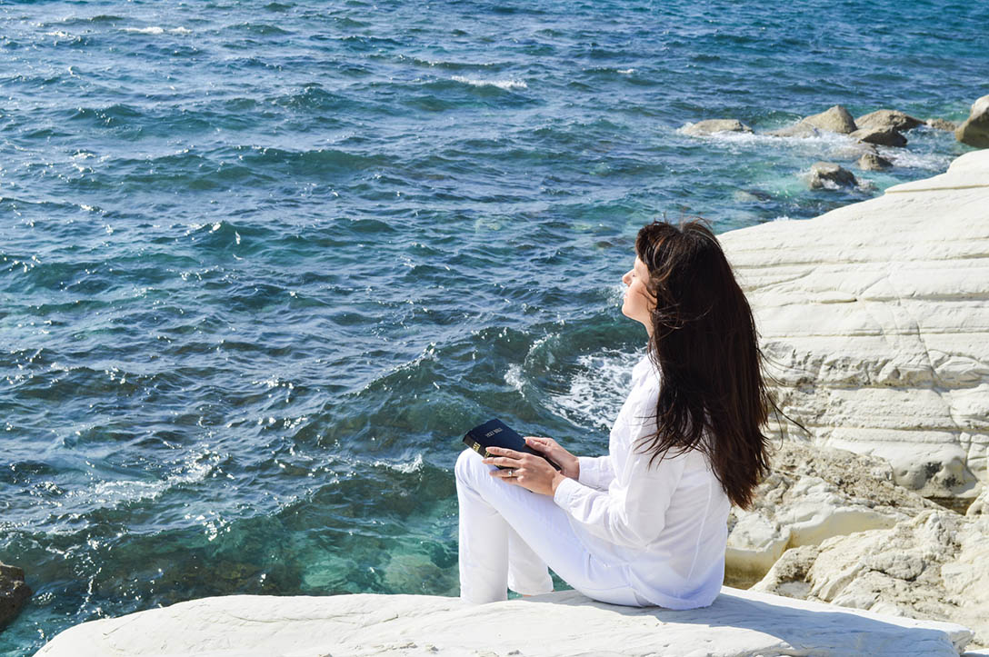 http://www.dreamstime.com/royalty-free-stock-photography-beautiful-girl-alone-beach-sitting-praying-to-god-image36920527