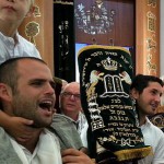 Holding one of 11 sacred Torah scrolls in a Tel Aviv synagogue this morning on Simchat Torah