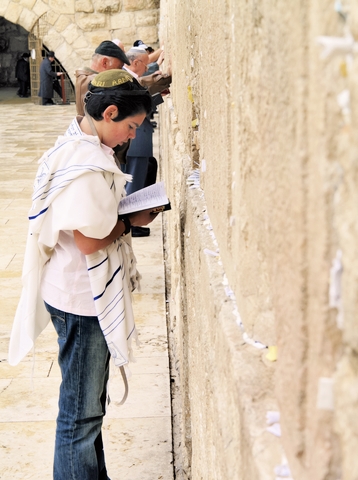 Young man-prays-Western (Wailing) Wall-Jerusalem