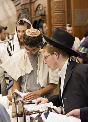 Young-Jewish-men-read-Torah-scrolls-Western-Wall-Jerusalem