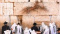 Jewish men pray at the Western Wall Plaza in Jerusalem