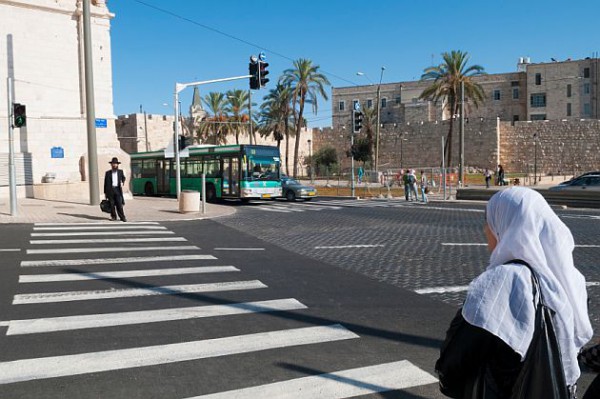 Jewish-man-Arab-woman-crosswalk-in-Jerusalem