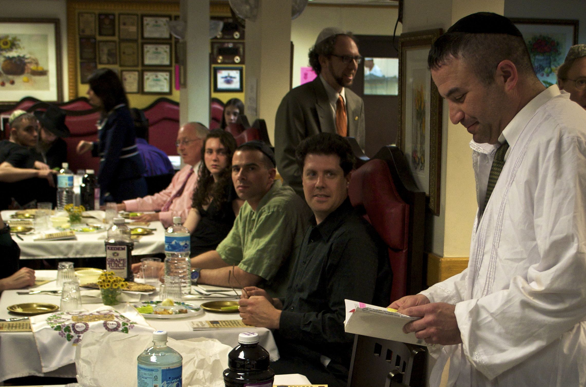 A Jewish man reads from the Haggadah during the Passover Seder.