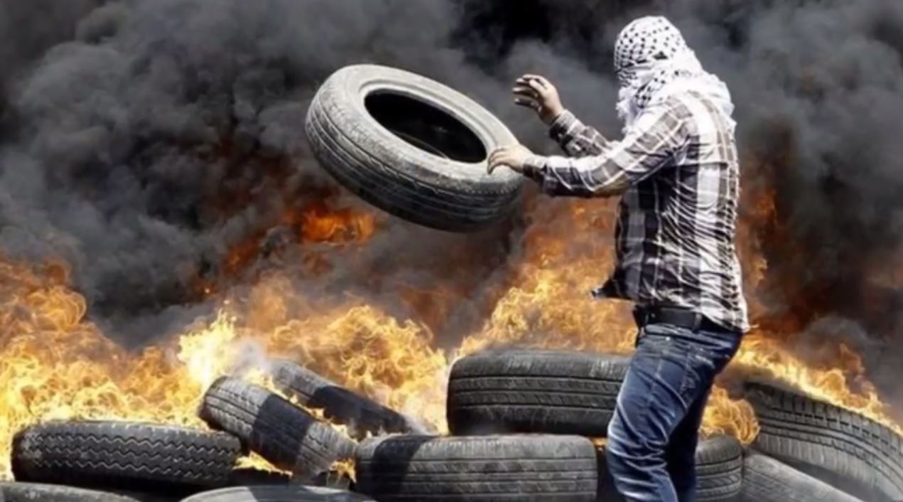 Palestinians burn tires in protest of the gruesome murder of Mohammed Abu Khdair. Palestinian-protest-burning tires-Abu Khadair