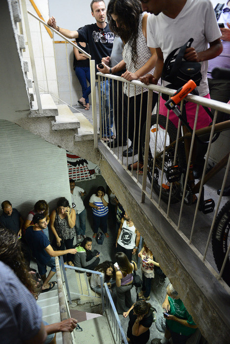 Israelis Take Cover in Stairwell Code Red Siren