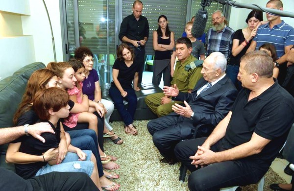 Shimon Peres comforts a grieving family during Operation Protective Edge Operation Protective Edge-Peres comforts a family