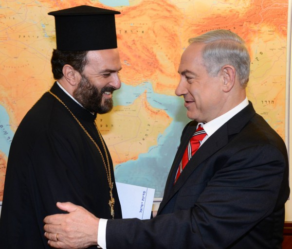 Israeli Prime Minister Benjamin Netanyahu greets Father Nadaf.