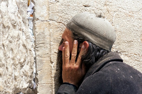 A homeless Israeli prays at the Western (Wailing) Wall in Jerusalem.