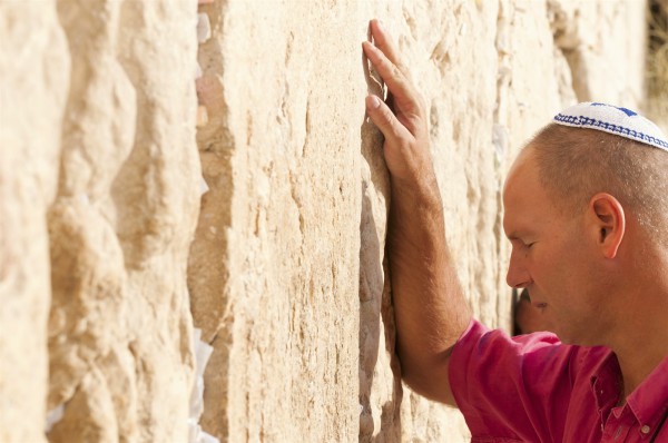 A Jewish man prays at the Western (Wailing) Wall.