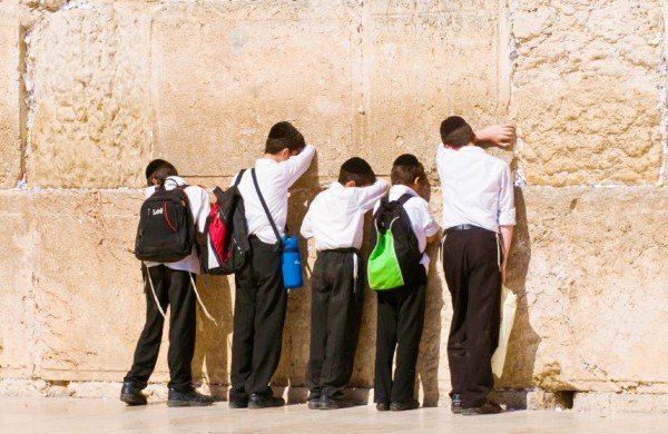 Orthodox Jewish children pray at the Western (Wailing) Wall.