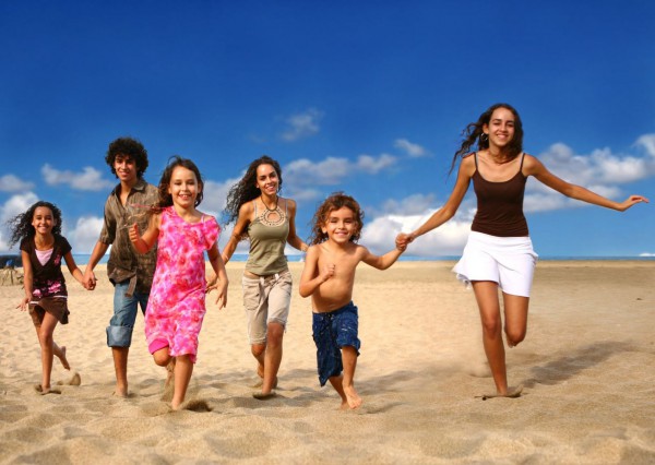 Siblings play beach Israeli