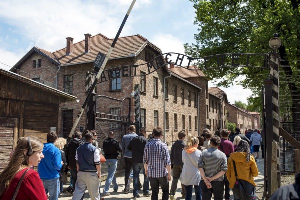 Visitors pass through a gate at Auschwitz that promises "Arbeit Macht Frei" (work makes [you] free). A great many Holocaust victims were literally worked to death by the Nazis.