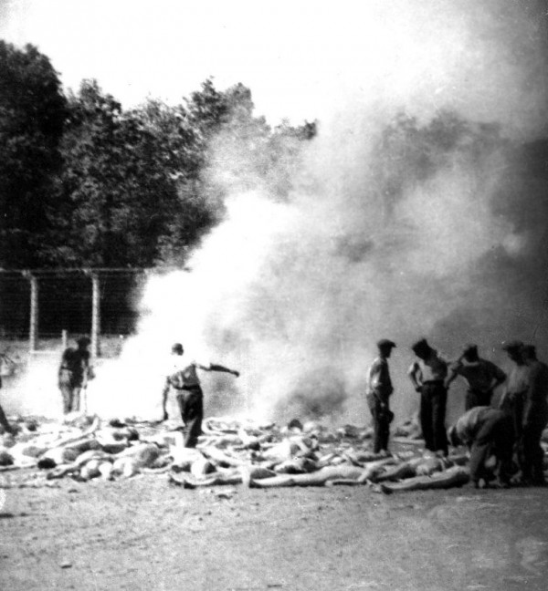 This secret photograph taken by a Sonderkommando is a cropped version of one of four photographs from Auschwitz-Birkenau, part of a series known as the Sonderkommando photographs. This photograph, number 280, shows bodies waiting to be burned in an outdoor fire pit.