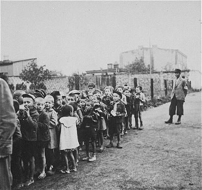 Jewish children in the Lodz Ghetto in German-Occupied Poland are rounded up for extermination in the Chelmno death camp.