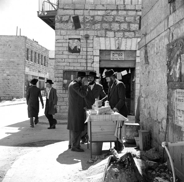 Orthodox Jewish men and street vendor in 1948 Jerusalem