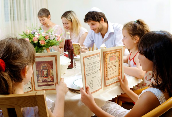 A Jewish family commemorates the Exodus of the Israelites from Egypt at the Passover Seder. The order of this special meal is set forth in the text called the Haggadah (telling). (Go Israel photo by Jorge Novominsky)