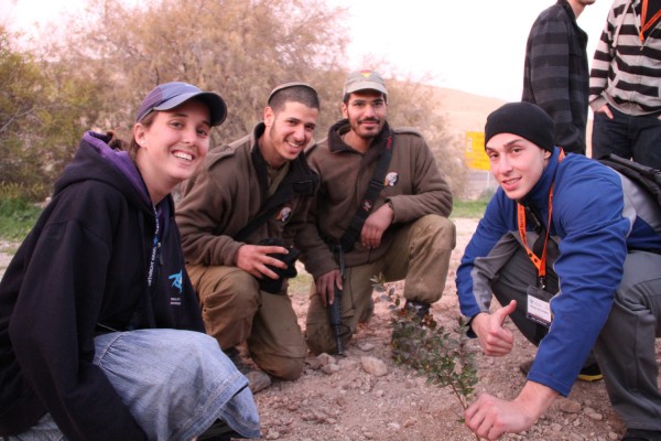 A group of American Jews visiting Israel plant trees together with IDF soldiers on Tu B'shvat.