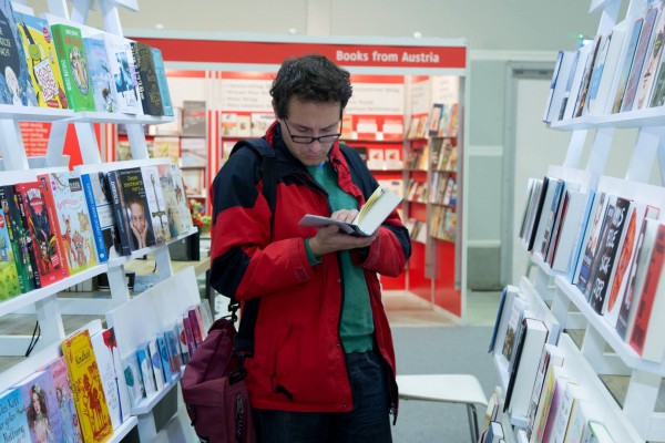 An Israeli peruses a book at  the 2015 Jerusalem Book Fair.