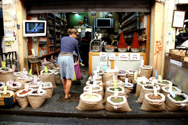 A woman enters a spice store in the Mahane Yehuda Market in Jerusalem.