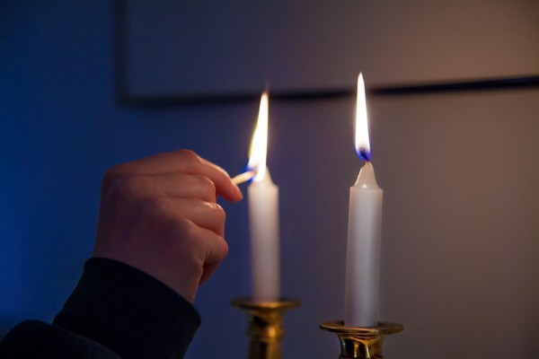 On Friday night, it is customary to kindle Shabbat candles just before the arrival of the Sabbath. (Photo by Robert Couse-Baker)