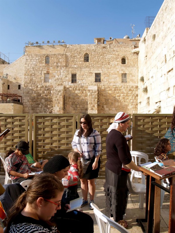 Women pray in the Women's Section of the Western Wall.