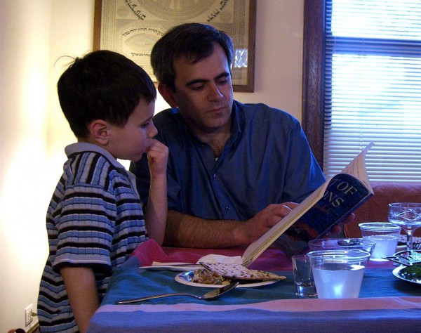 Reading through the Haggadah during a Passover Seder.