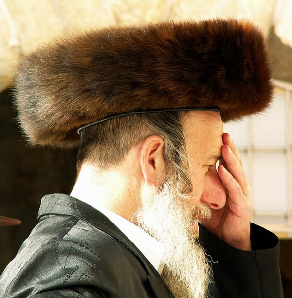 An Orthodox Jewish man wearing a shtreimel prays at the Western (Wailing) Wall in Jerusalem.