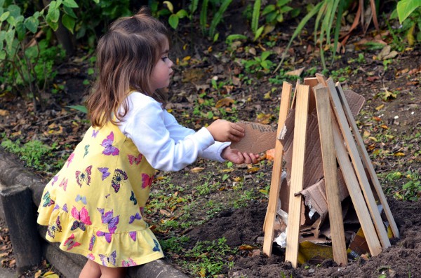 An Israeli girl helps prepare the Lag BaOmer fire.