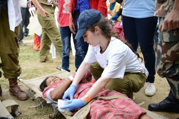 Israel Defense Forces soldier-Nepalese woman on stretcher