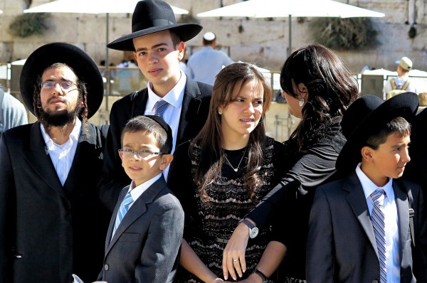 An Israeli Orthodox family at the Western Wall in Jerusalem. (Photo by Reinhardt Konig)