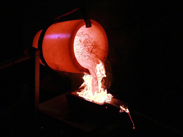 Pouring smelted gold into moulds