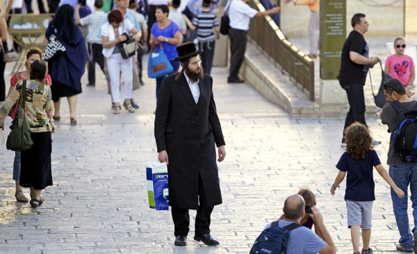 An ultra-Orthodox Jewish man on his way to pray at the Western (Wailing) Wall in Jerusalem.