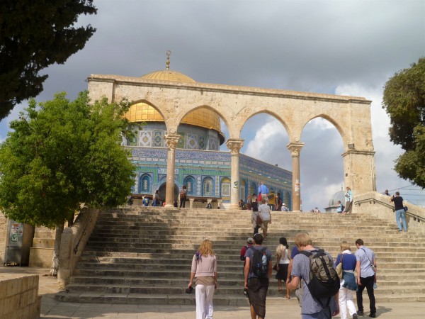 Tourists on the Temple Mount ascend a flight of stairs toward the Muslim Dome of the Rock, which is thought to occupy the spot where the Holy of Holies in Solomon's Temple was located.