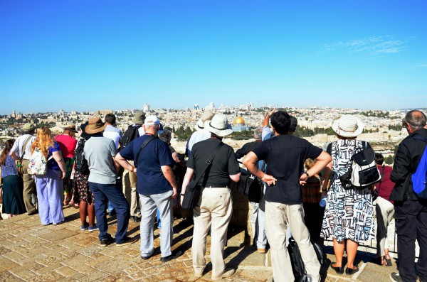 Tourists on the Mount of Olives look toward Jerusalem. (Photo by Michael Jones)