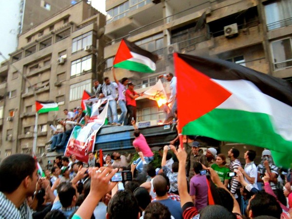 On May 15, 2011, Egyptian protesters waved Palestinian flags in front of the Israeli embassy in Giza as they burned a makeshift Israeli flag.