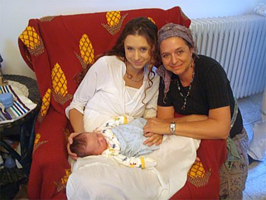 Proud Jewish grandmother with her daughter and her eight day old grandson at his brit milah.