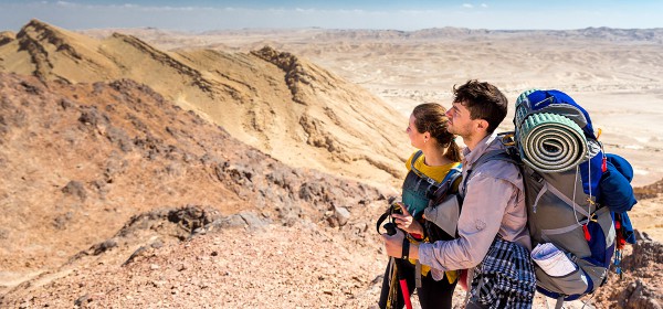 A couple stands at the Ramon Crater in southern Israel's Negev desert.