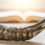 Shofar, ram' horn, in front of Bible